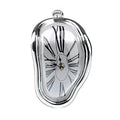 Silver melting clock, polished chrome enamel rim with a white dial and printed Roman numerals